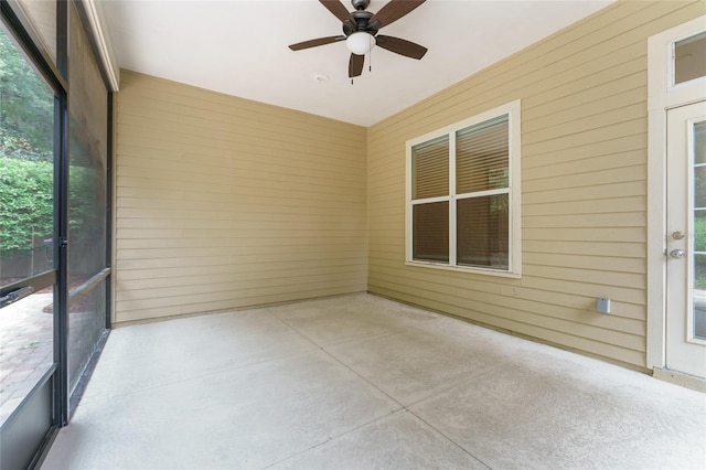 8650 SW 26th Ln, Gainesville, FL 32608 - unfurnished sunroom featuring ceiling fan