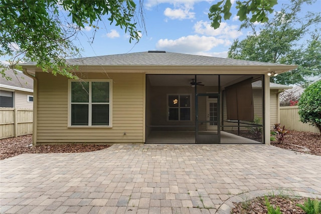 8650 SW 26th Ln, Gainesville, FL 32608 - rear view of property featuring a sunroom, a patio, and a ceiling fan