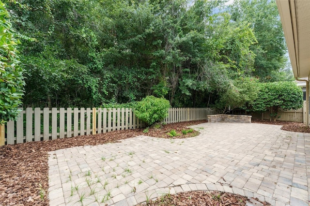 8650 SW 26th Ln, Gainesville, FL 32608 - fenced backyard with a patio area