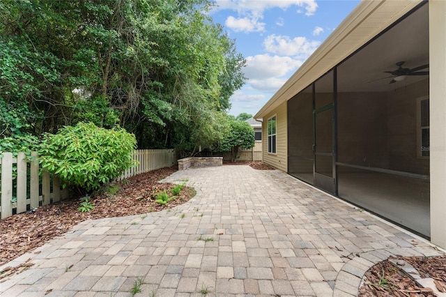 8650 SW 26th Ln, Gainesville, FL 32608 - fenced backyard featuring a patio and a ceiling fan