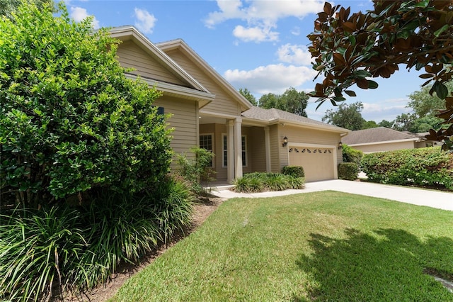 8650 SW 26th Ln, Gainesville, FL 32608 - view of front facade with a garage, driveway, and a front yard