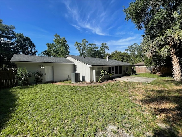 4121 NW 15th Pl, Gainesville, FL 32605 - back of property featuring a patio area and a chimney