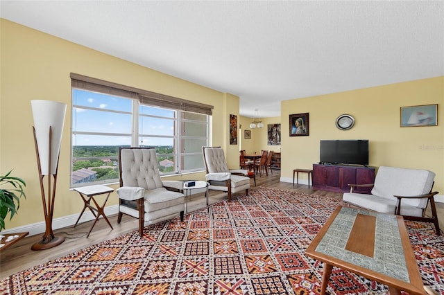 10777 W Sample Rd Unit 1212, Coral Springs, FL 33065 - living area with baseboards and wood finished floors