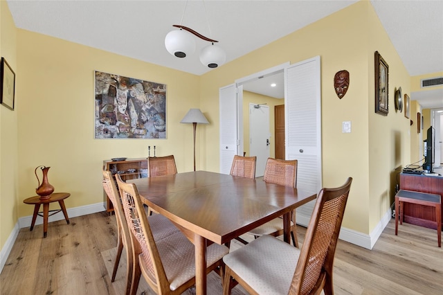 10777 W Sample Rd Unit 1212, Coral Springs, FL 33065 - dining room with light wood finished floors and baseboards