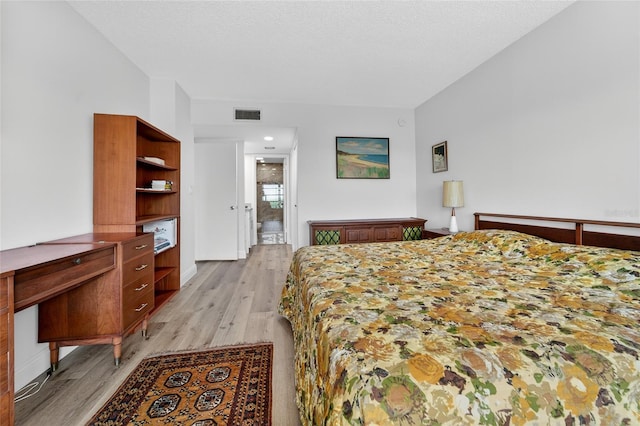 10777 W Sample Rd Unit 1212, Coral Springs, FL 33065 - bedroom with light wood-style floors