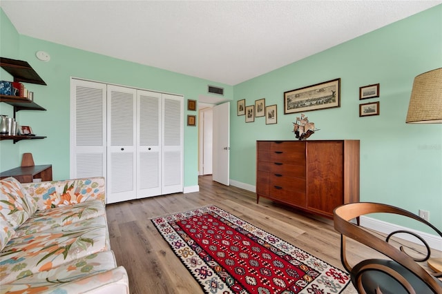 10777 W Sample Rd Unit 1212, Coral Springs, FL 33065 - living area with wood finished floors and baseboards