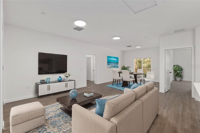 1581 NW 29th Rd Unit 1, Gainesville, FL 32605 - living area featuring wood finished floors and baseboards
