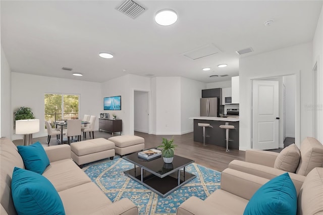 1581 NW 29th Rd Unit 1, Gainesville, FL 32605 - living area with attic access, wood finished floors, and recessed lighting