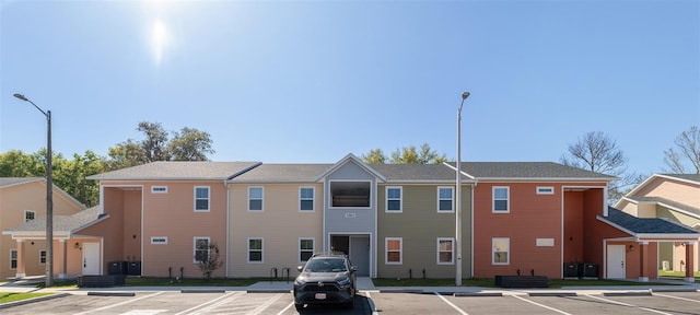 1581 NW 29th Rd Unit 1, Gainesville, FL 32605 - view of building exterior featuring uncovered parking