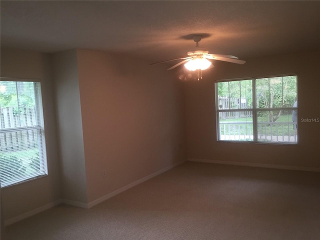 2375 SW 42nd Way Unit 160, Gainesville, FL 32607 - empty room with healthy amount of natural light, light carpet, and a ceiling fan