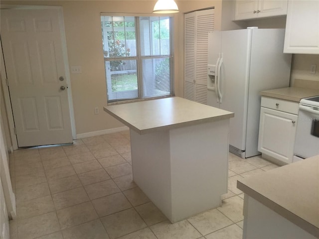 2375 SW 42nd Way Unit 160, Gainesville, FL 32607 - kitchen featuring white appliances, light tile patterned floors, white cabinetry, and light countertops