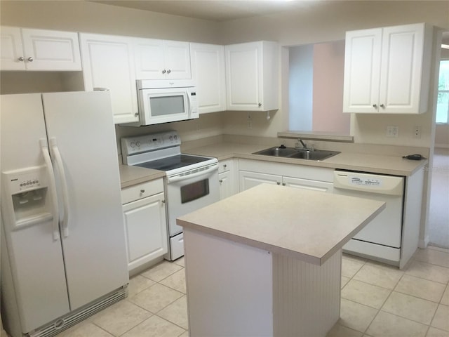 2375 SW 42nd Way Unit 160, Gainesville, FL 32607 - kitchen featuring white appliances, light tile patterned floors, a kitchen island, and white cabinets