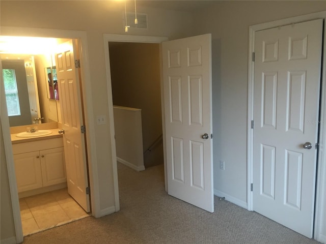 2375 SW 42nd Way Unit 160, Gainesville, FL 32607 - unfurnished bedroom featuring light carpet and connected bathroom