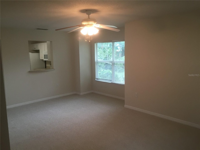 2375 SW 42nd Way Unit 160, Gainesville, FL 32607 - empty room featuring light colored carpet and ceiling fan