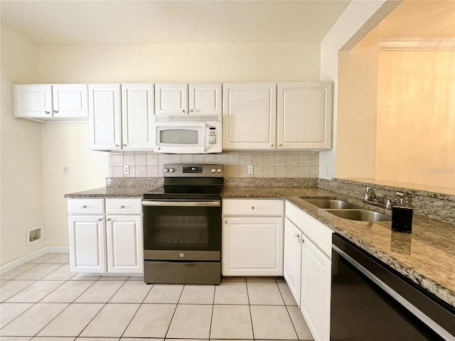 4877 NW 42nd Rd Unit 106, Gainesville, FL 32606 - kitchen with stainless steel electric range oven, dishwasher, white microwave, white cabinetry, and backsplash
