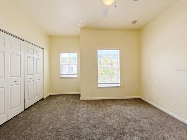 4877 NW 42nd Rd Unit 106, Gainesville, FL 32606 - unfurnished bedroom featuring carpet floors, a closet, and ceiling fan
