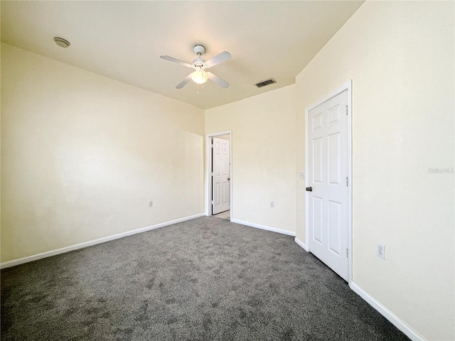 4877 NW 42nd Rd Unit 106, Gainesville, FL 32606 - unfurnished bedroom with dark colored carpet and a ceiling fan