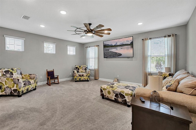 carpeted living area with baseboards, a ceiling fan, visible vents, and recessed lighting