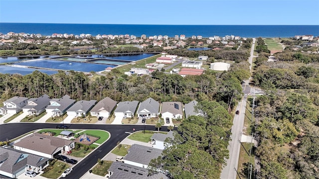 aerial view featuring a water view and a residential view