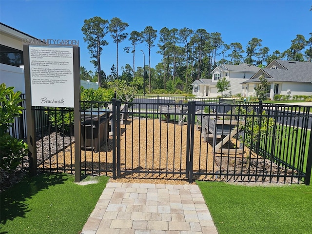 exterior space with a residential view and fence