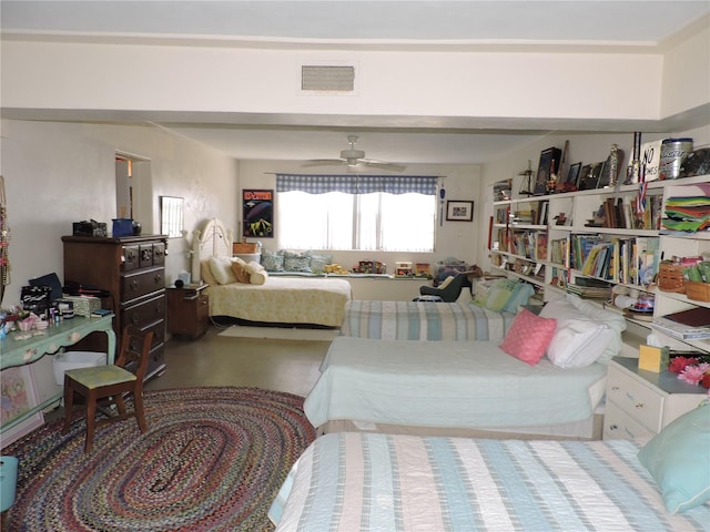 bedroom with concrete flooring and ceiling fan