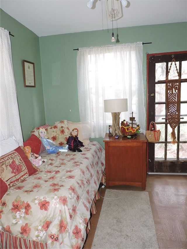 bedroom featuring multiple windows