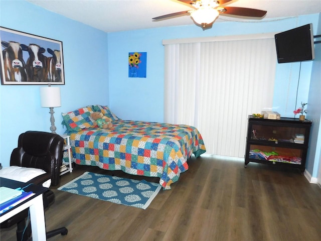 bedroom featuring dark hardwood / wood-style flooring and ceiling fan