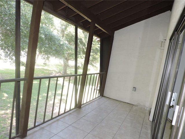 unfurnished sunroom featuring plenty of natural light