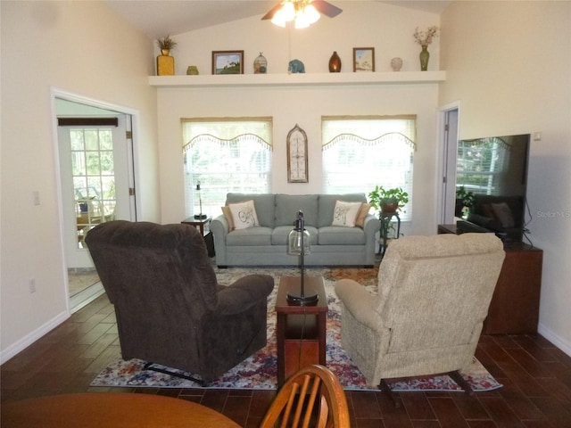 living room featuring ceiling fan and lofted ceiling