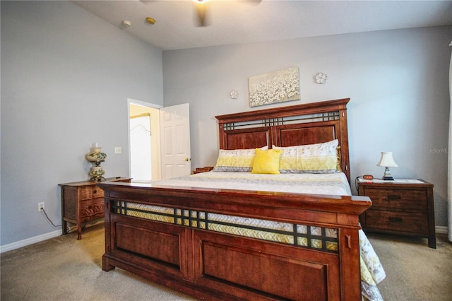 bedroom with light carpet, ceiling fan, and lofted ceiling