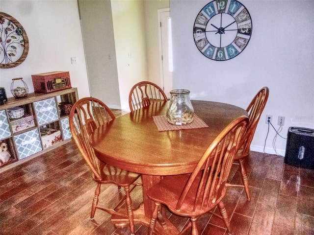 dining room featuring dark wood-type flooring