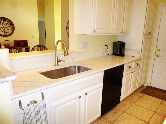 kitchen featuring light tile patterned floors, black dishwasher, white cabinetry, and sink