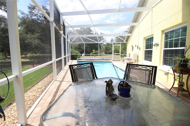 sunroom / solarium with vaulted ceiling and a pool