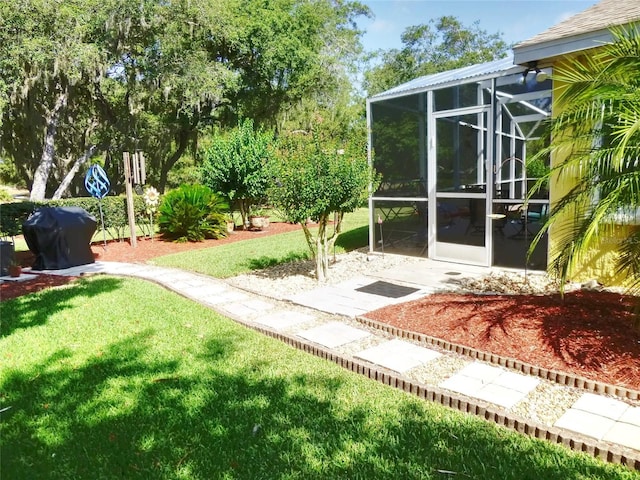 view of yard with a sunroom