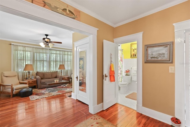 interior space with wood-type flooring and ornamental molding