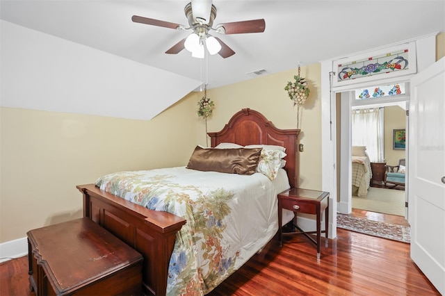 bedroom featuring hardwood / wood-style flooring and ceiling fan