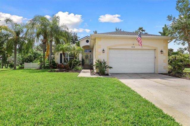 view of front facade with a garage and a front lawn