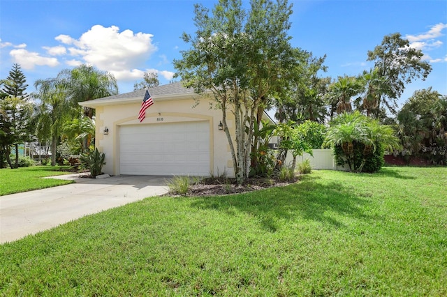 view of front of house with a garage and a front yard