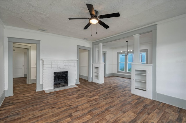 unfurnished living room with ceiling fan with notable chandelier, a fireplace, a textured ceiling, and wood-type flooring