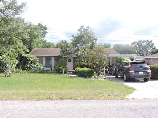 view of front of property featuring a carport and a front lawn