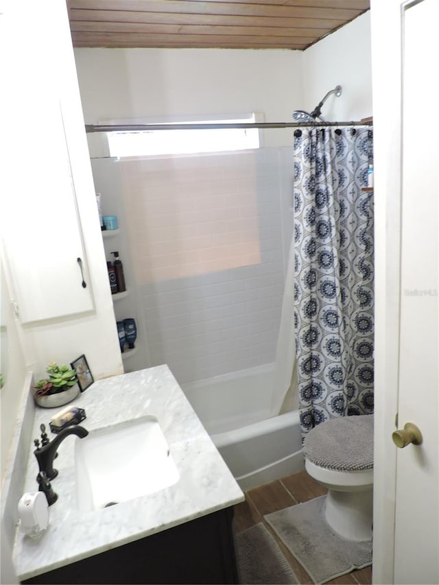 full bathroom featuring hardwood / wood-style flooring, vanity, wooden ceiling, toilet, and shower / bath combo with shower curtain