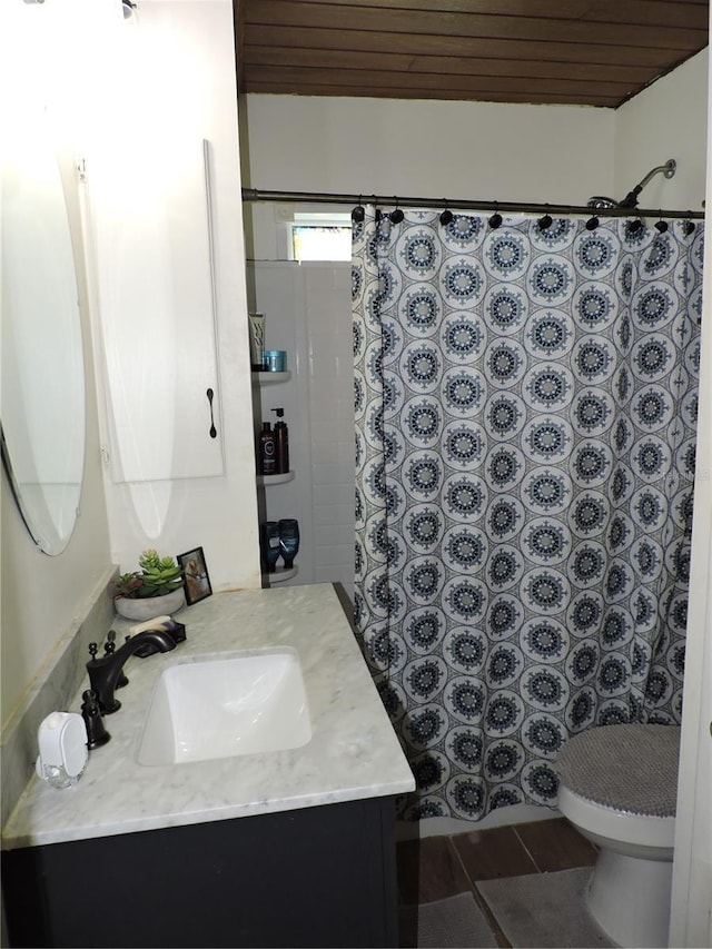 bathroom with a shower with curtain, vanity, toilet, and wooden ceiling