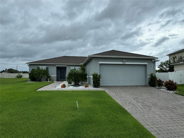 ranch-style home with a front yard and a garage