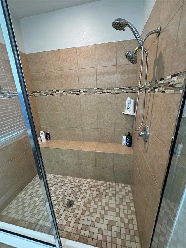 bathroom featuring an enclosed shower