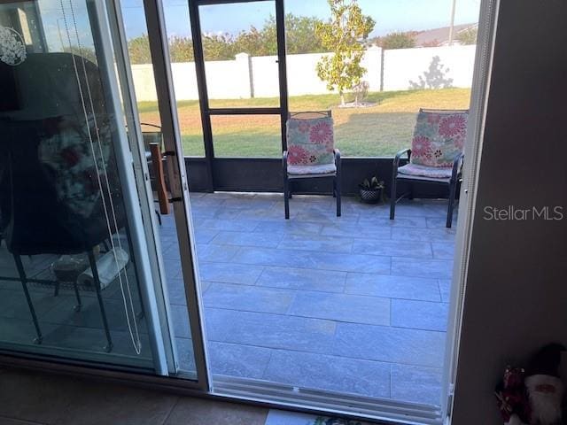 entryway with tile patterned floors