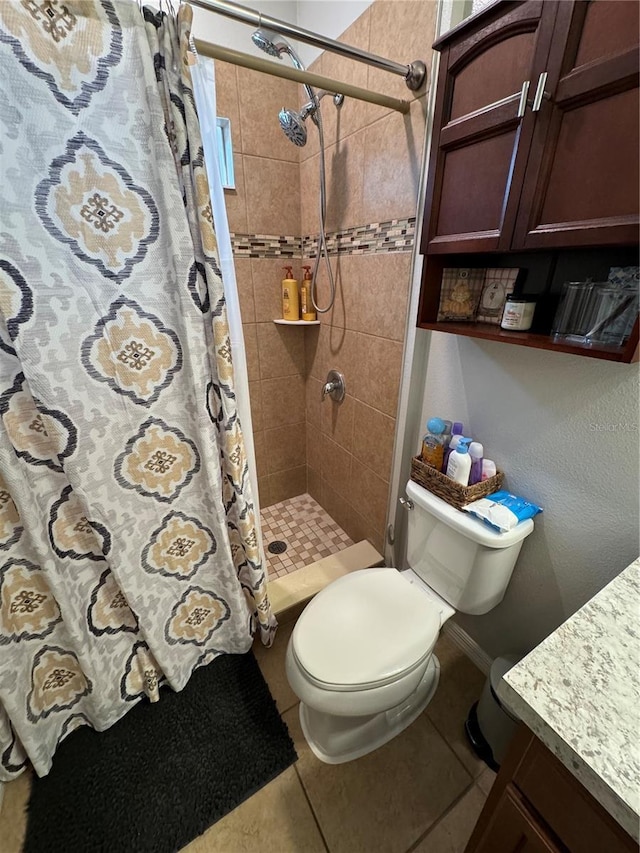 bathroom with tile patterned flooring, toilet, and walk in shower