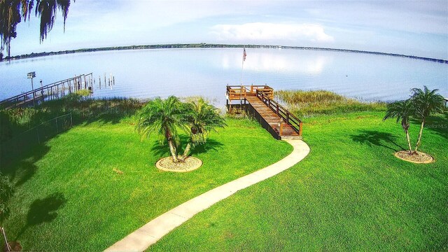 exterior space with a dock and a water view