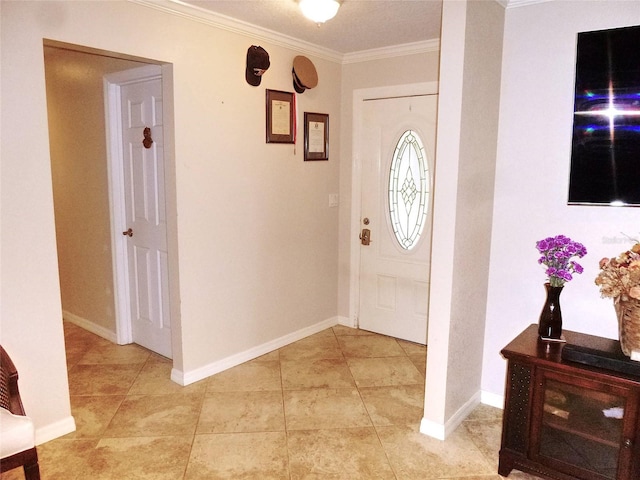 entrance foyer featuring ornamental molding and light tile patterned floors