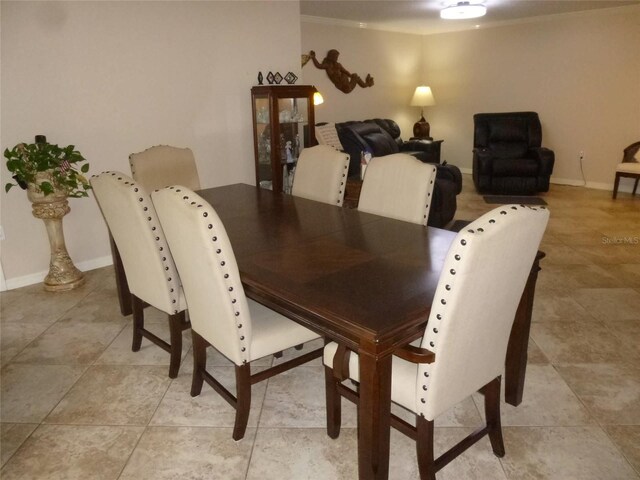 dining area featuring light tile patterned flooring