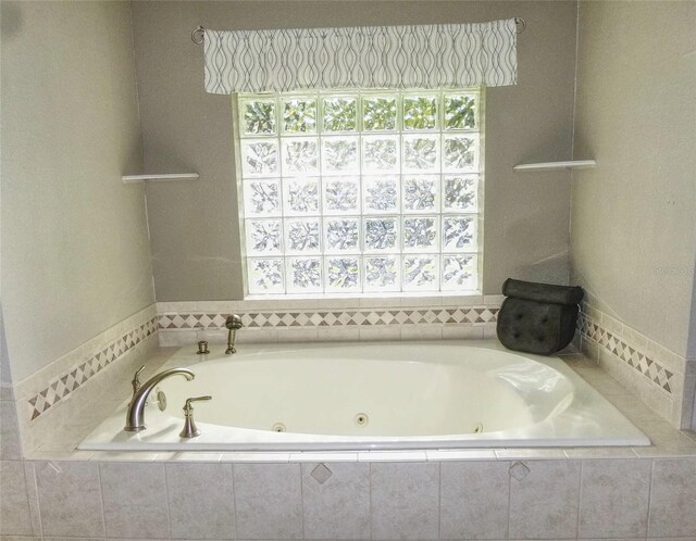 bathroom featuring tiled bath